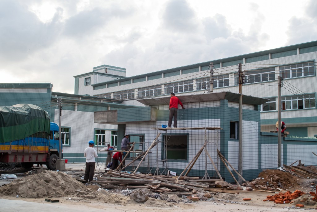 Gatehouse finishing — same tile language as the main plant.